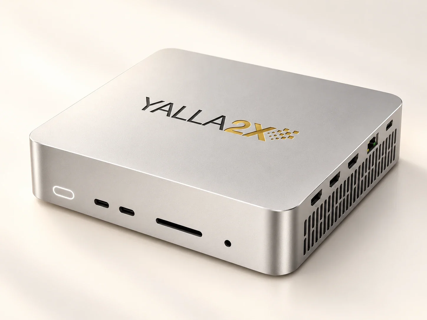 The Yalla2X Box: a small silver desktop computer with the Yalla2x logo on its lid and ports along its front